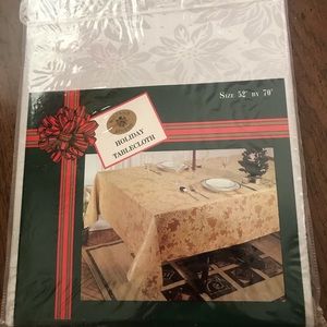 Brand New. Silver tablecloth. 52x70.